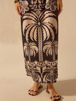 CAJUNI Vestido casual de verão com decote com laço, fenda e estampa boêmia tropical de pássaros, palmeiras e flores, para férias